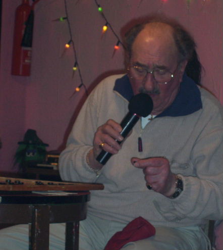 Gordon Cragg seated stairing hard at a bingo number